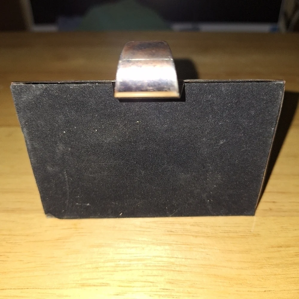 An unbranded Penguin Stocking Holder    It's base is 4